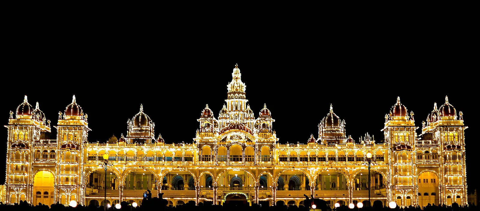 Mysore Palace fully illuminated at night