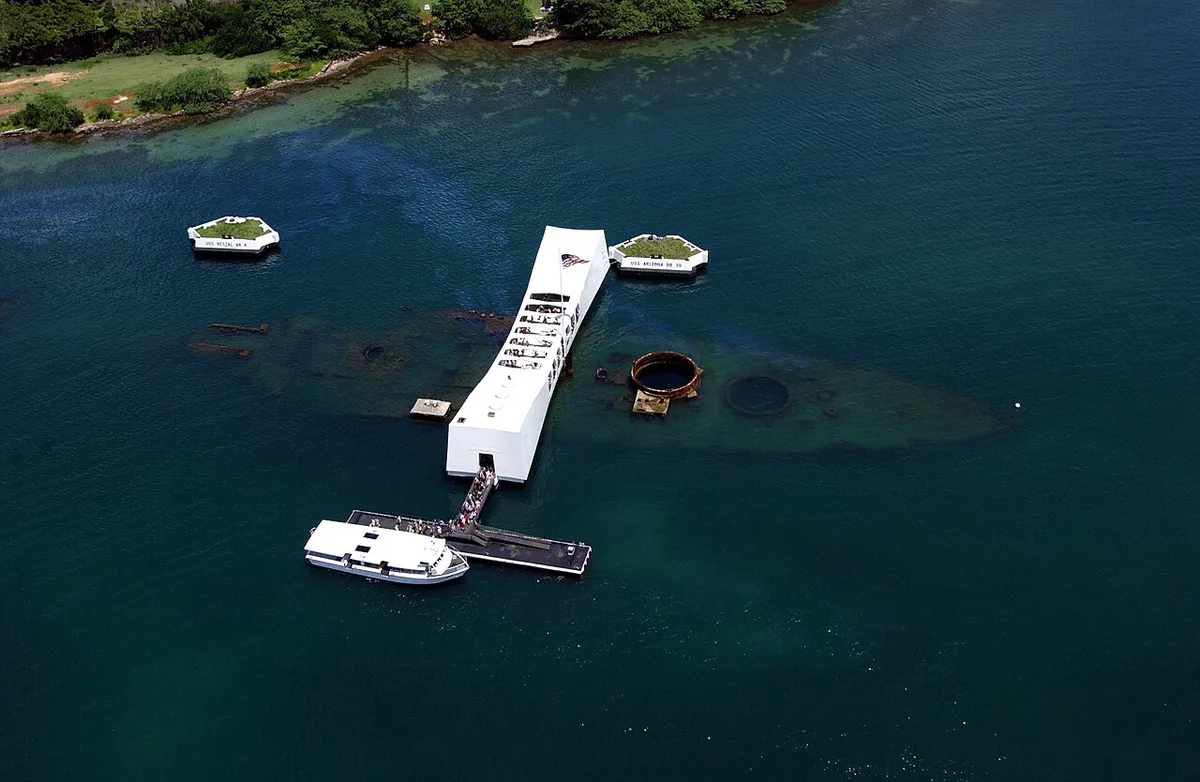 Aerial view of the USS Arizona Memorial spanning the sunken battleship at Pearl Harbor