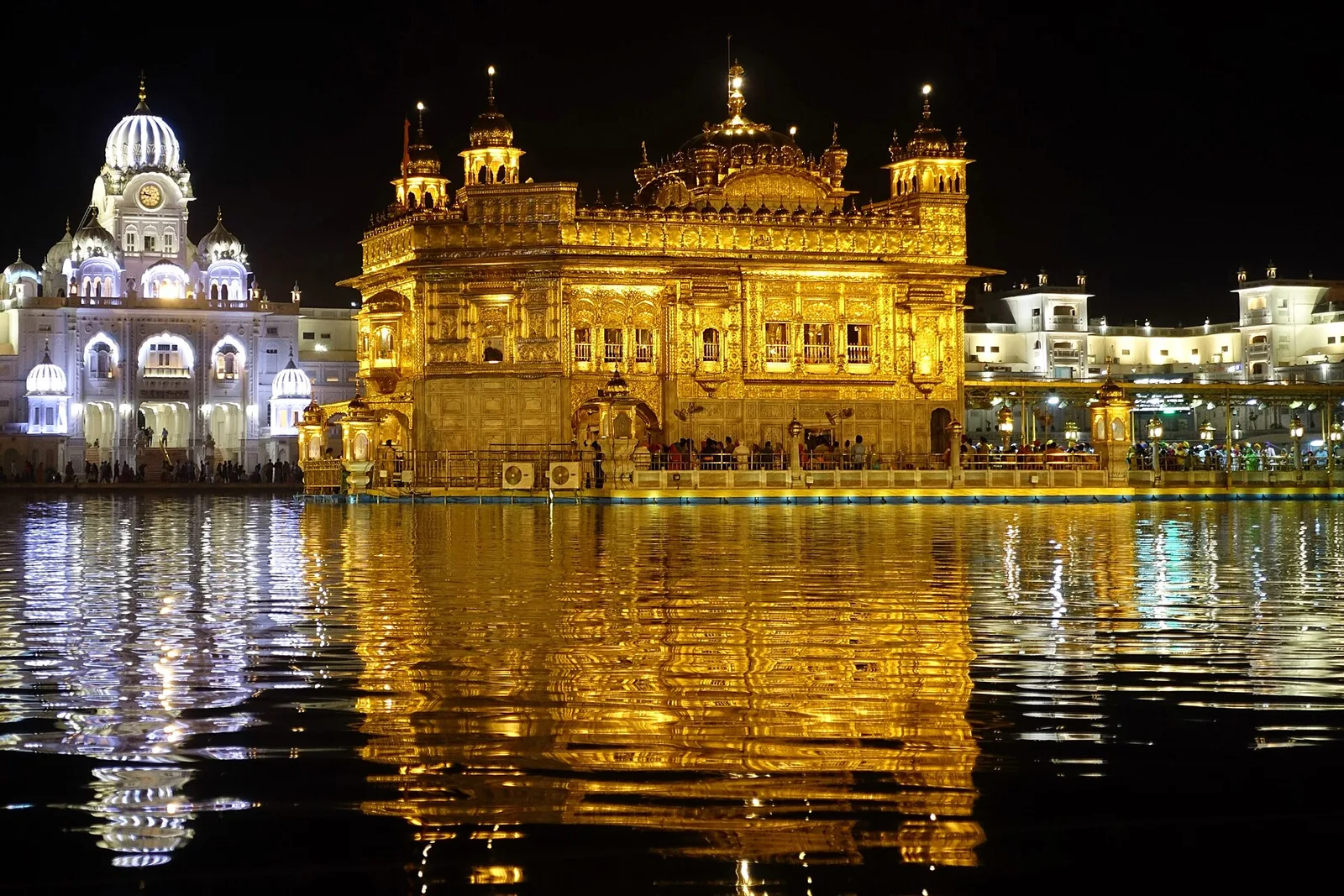 The Golden Temple lit at night, reflected in the sarovar at Amritsar