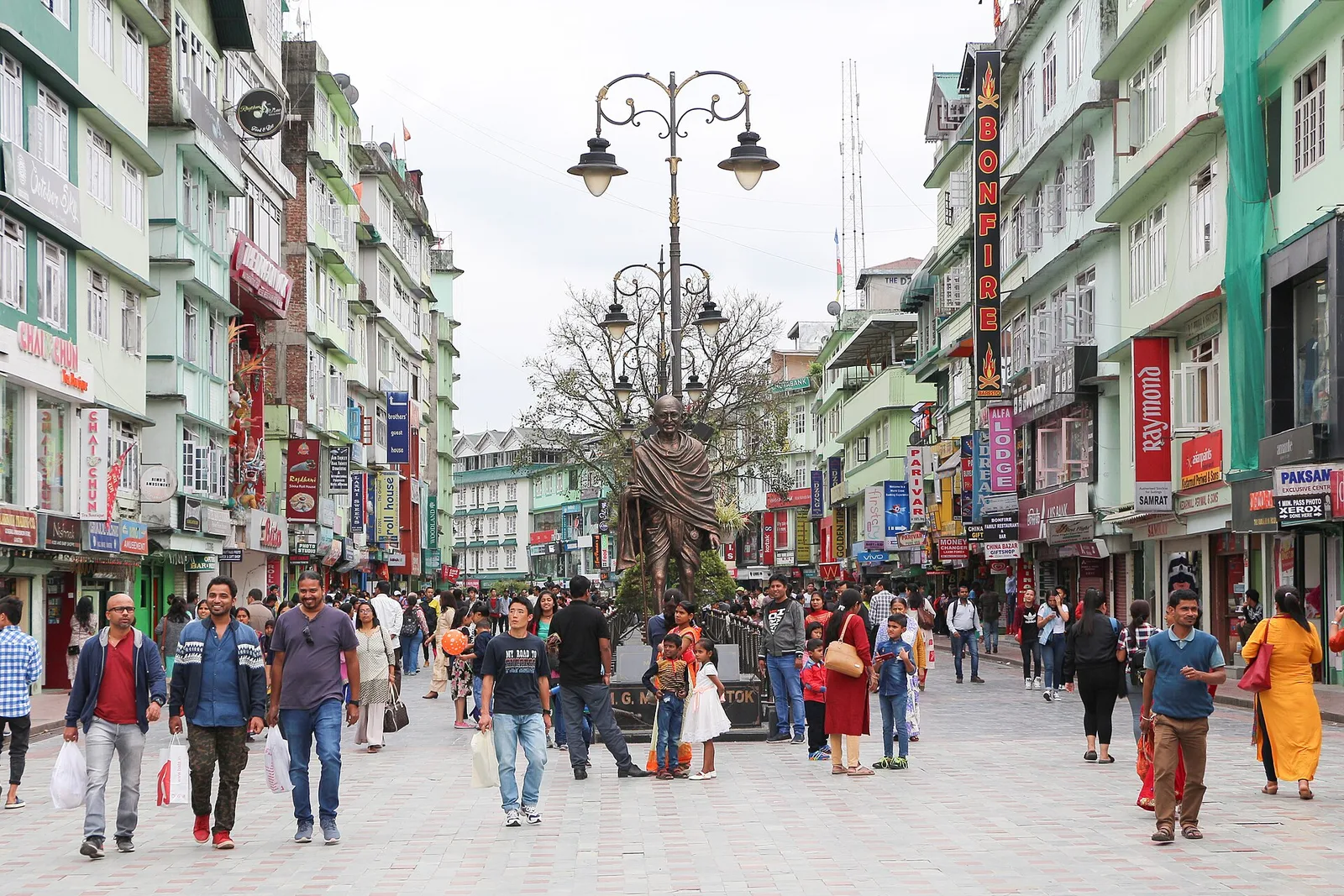 MG Marg, Gangtok's pedestrian main street, with the Gandhi statue and crowds of shoppers